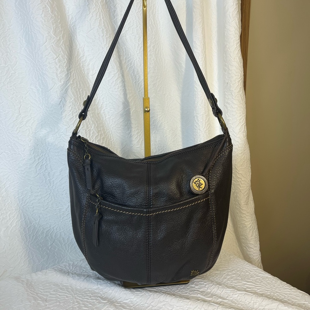 The Sak Brown Shoulder Bag with Pebbled Texture and Adjustable Strap